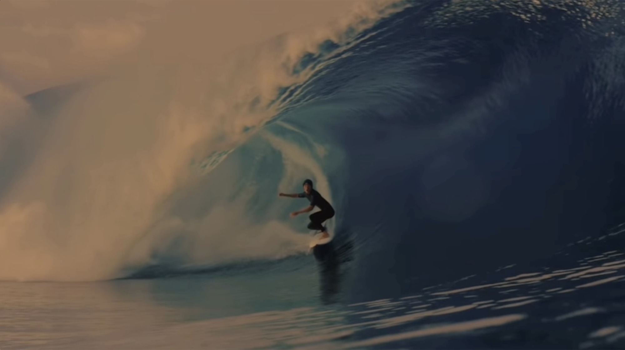 Quinn Biviano deep in a barrel at sunset