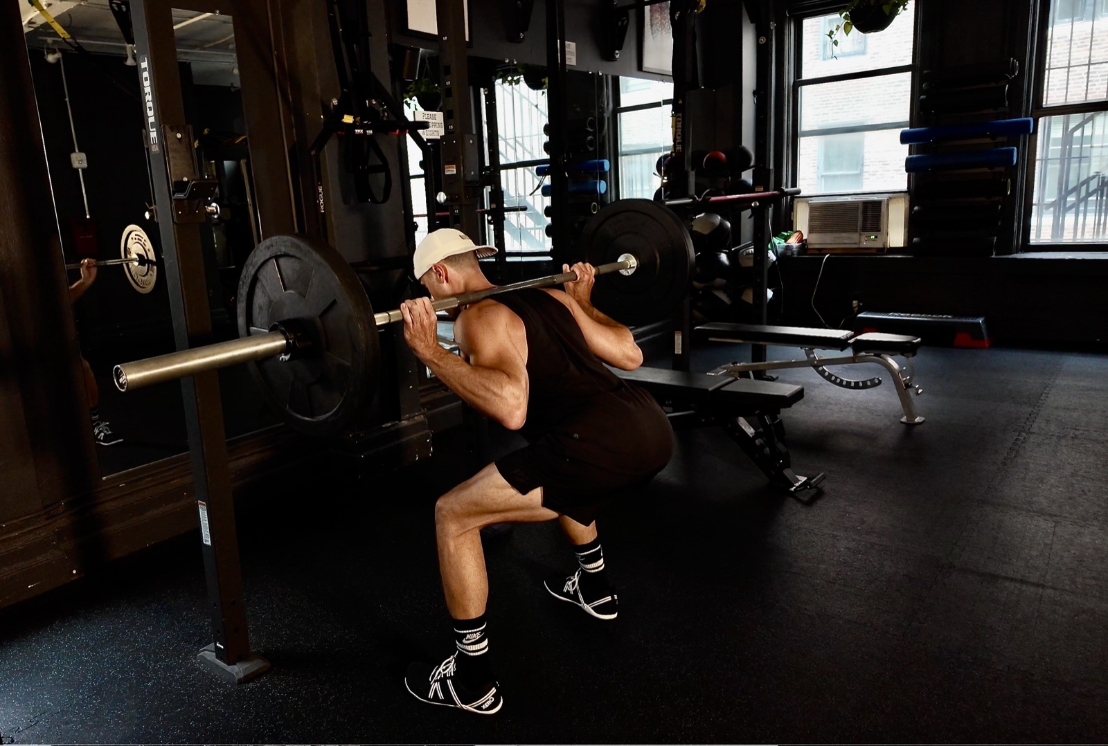 Barbell squat in the gym